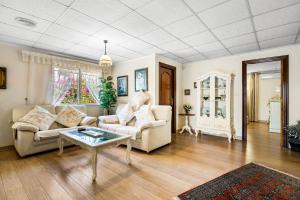 a living room with two couches and a coffee table at Casa Starlite Sunrise in Almoradí