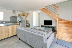 a living room with a couch and a kitchen at Villa Ker Minet - Houat - 8 pers in Piriac-sur-Mer