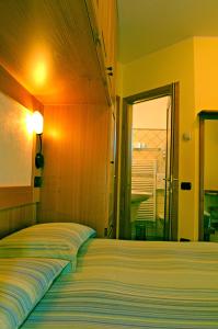 Postel nebo postele na pokoji v ubytování BiancaNeve B&B