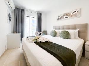 Postel nebo postele na pokoji v ubytování Apartment Praia Rocha Justar