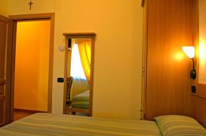 Postel nebo postele na pokoji v ubytování BiancaNeve B&B