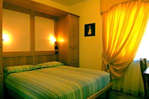 Postel nebo postele na pokoji v ubytování BiancaNeve B&B