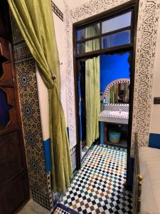 Postel nebo postele na pokoji v ubytování Riad Lalla Zoubida