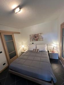 Postel nebo postele na pokoji v ubytování Appartamento Casa Amanda
