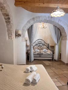 Postel nebo postele na pokoji v ubytování Resort Romano in Trulli