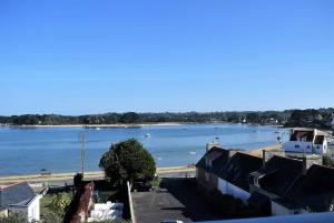 a view of a river with boats in the water at Appartement VUE MER 4 personnes au centre de TREGASTEL - Ref 95 in Trégastel