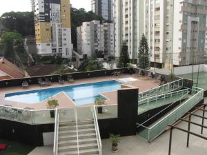 a swimming pool on the roof of a building at RCM Vilas - Morada 409 in Joinville
