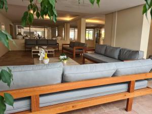 a living room with a couch and a table at Praia Brava Hotel in Florianópolis