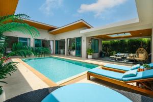 an image of a swimming pool in a villa at Villa Mimosa 1, Splendid 4 Bedroom Master Ensuite in Phuket Town