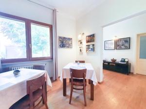 a dining room with a table and two chairs at B&B Antico Sentiero in Cesena