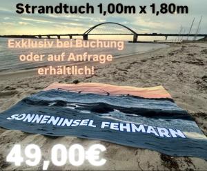 a blanket on the sand on a beach at Südstrand Perle in Burgtiefe auf Fehmarn 