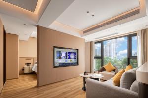 TV a/nebo společenská místnost v ubytování Jiangmen Poltton Executive Service Apartment