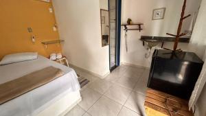 Cama ou camas em um quarto em Pousada Canto do Mar Ilha Grande