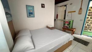 Cama ou camas em um quarto em Pousada Canto do Mar Ilha Grande