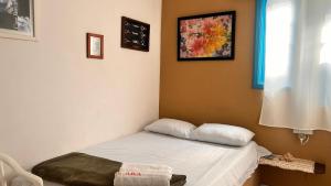 Cama ou camas em um quarto em Pousada Canto do Mar Ilha Grande