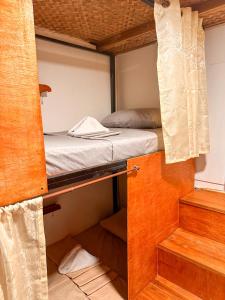 Postel nebo postele na pokoji v ubytování Hangout's Hostel El Nido