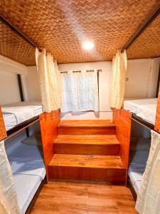 Postel nebo postele na pokoji v ubytování Hangout's Hostel El Nido