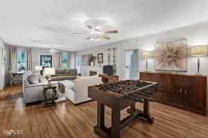 a living room with a ping pong table in it at Grand Harbor, Lakefront, With Kayaks & Canoes in Karnack