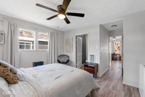 a bedroom with a bed and a ceiling fan at Lakefront Southern Pearl With Kayaks & Canoes in Karnack +31 photos