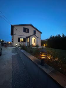 a house with a fire hydrant in front of it at Villa Desideria in Bribir