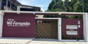 a pair of garage doors in front of a building at Vila WS in Manaus