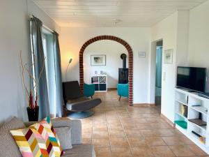 TV a/nebo společenská místnost v ubytování Ferienhaus Nordseeperle
