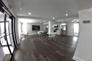 an empty room with a table and chairs in a building at The Sandstone Suite in Cleveland