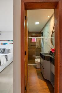 a bathroom with a sink and a toilet in a room at Bahia Soul - Lake House - Barra Grande - Península de Maraú in Barra Grande