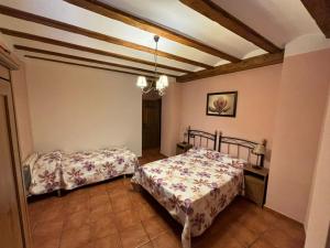 Posteľ alebo postele v izbe v ubytovaní Casa Rural Carcelen