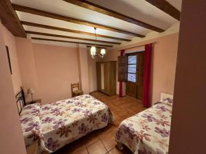 Posteľ alebo postele v izbe v ubytovaní Casa Rural Carcelen