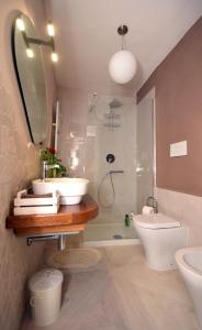 a bathroom with a sink and a toilet and a shower at Le mura antiche in Spoleto +42 photos
