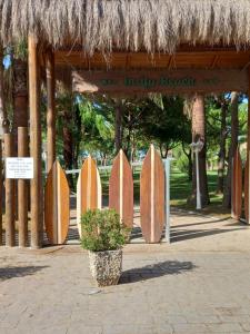 a row of surfboards in front of a building at Adria Apartment in Lalzit Bay