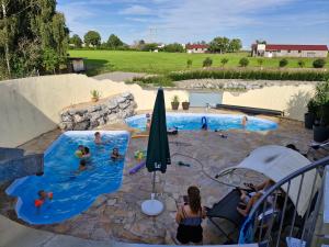 a group of people in a swimming pool at Farmhaus in Ravensburg