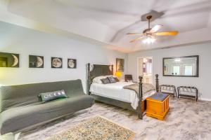 a bedroom with a bed and a couch at 4 Mi to Beach Family-Friendly Home in Navarre in Navarre