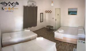 a room with two beds in a room at Luar Da Barra in Barra Grande