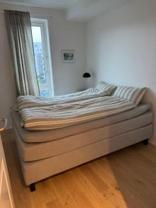 Ένα ή περισσότερα κρεβάτια σε δωμάτιο στο Seaside view appartement