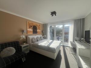 Postel nebo postele na pokoji v ubytování Grand Petit Hotel ex Shato Gesson