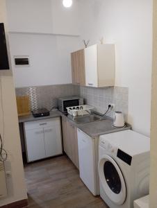 Kuchyň nebo kuchyňský kout v ubytování Adriatica Apartments