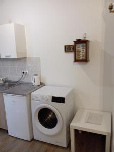Kuchyň nebo kuchyňský kout v ubytování Adriatica Apartments