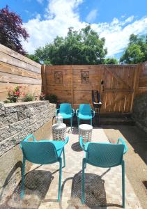 a group of chairs and tables on a patio at Jennifer's College Hill Apartment Private Entry & Patio in Providence