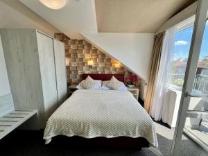 Postel nebo postele na pokoji v ubytování Grand Petit Hotel ex Shato Gesson