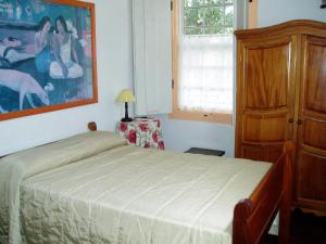 Кровать или кровати в номере Pousada Pouso do Sô Vigario