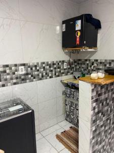 a kitchen with a sink and a counter top at Kitnet Europa in Bonito +3 photos