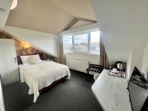 Postel nebo postele na pokoji v ubytování Grand Petit Hotel ex Shato Gesson