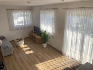 Televízia a/alebo spoločenská miestnosť v ubytovaní Ferienwohnung Brandtner Leogang