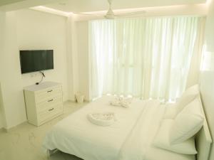 Postel nebo postele na pokoji v ubytování Beachfront Apartment