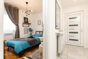 Postel nebo postele na pokoji v ubytování Deluxe Apartment RoMa