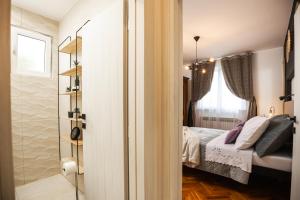 Postel nebo postele na pokoji v ubytování Deluxe Apartment RoMa