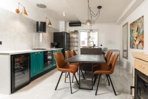 Kuchyň nebo kuchyňský kout v ubytování Deluxe Apartment RoMa