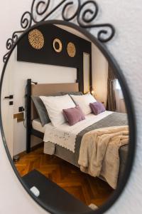 Postel nebo postele na pokoji v ubytování Deluxe Apartment RoMa